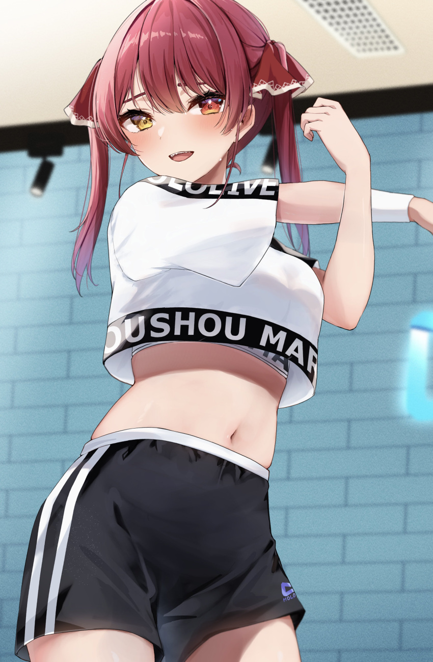 1girl :d absurdres black_shorts breasts character_name crop_top crop_top_overhang crossed_arms heterochromia highres hololive hololive_dance_practice_uniform houshou_marine indoors large_breasts midriff navel open_mouth outstretched_arm red_eyes red_hair shorts smile solo stomach stretching twintails virtual_youtuber yellow_eyes yoshinon_(yoshinon_kotori)