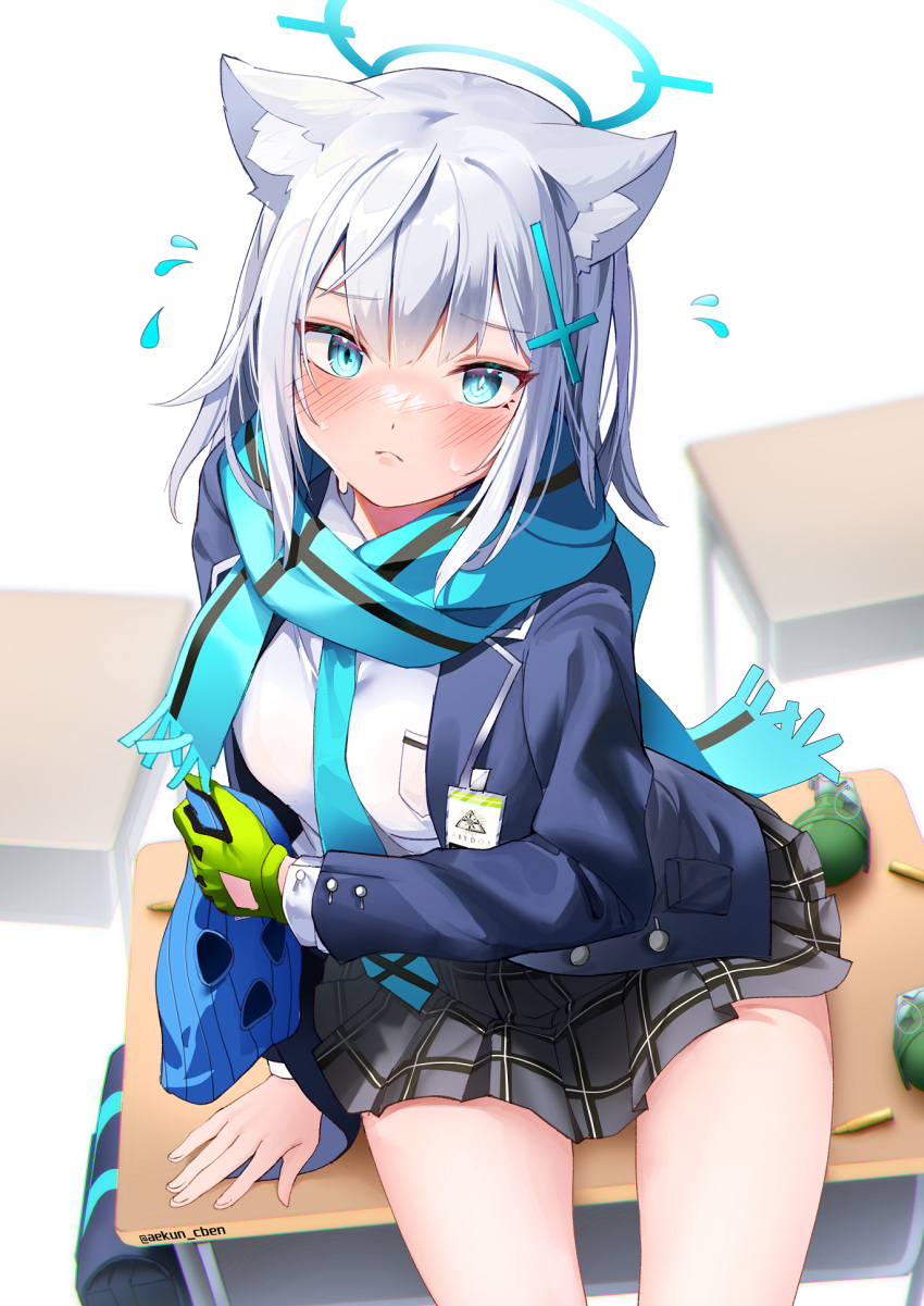 1girl aekun_cben animal_ear_fluff animal_ears blue_archive blue_eyes blue_scarf blush bullet closed_mouth cross_hair_ornament desk explosive flying_sweatdrops gloves green_gloves grenade grey_hair hair_ornament halo highres holding_headgear looking_at_viewer on_desk pleated_skirt scarf shiroko_(blue_archive) sidelocks single_glove sitting sitting_on_desk skirt solo sweat thighs twitter_username wolf_ears