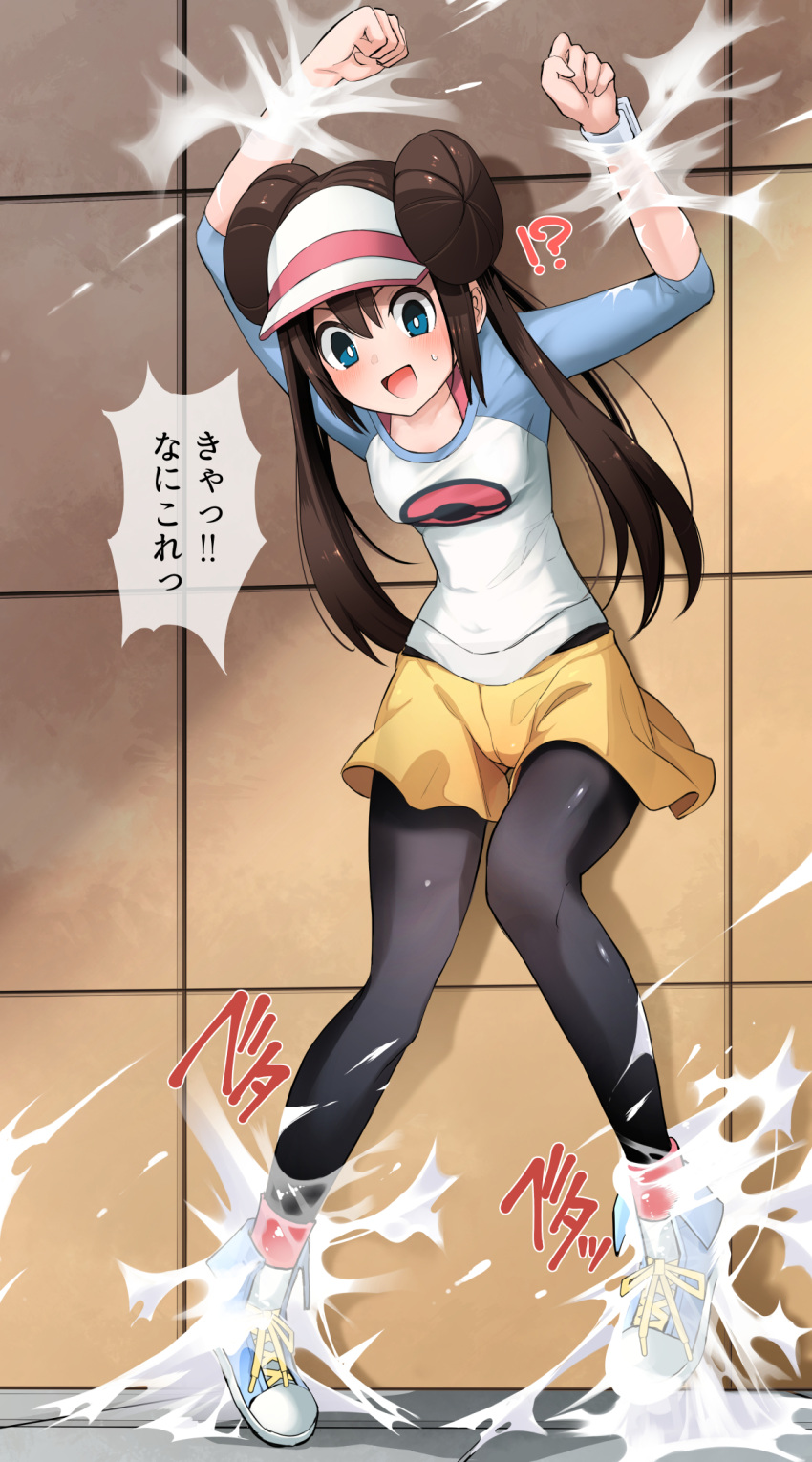 !? 1girl arms_up blue_eyes blush bright_pupils brown_hair clenched_hands commentary_request double_bun doughnut_hair_bun hair_bun highres long_hair looking_down nervous_smile open_mouth pantyhose_under_shorts pokeeti pokemon pokemon_(game) pokemon_bw2 raglan_sleeves restrained rosa_(pokemon) shirt shorts smile solo standing sweatdrop tile_wall tiles tiptoes tongue twintails visor_cap white_pupils yellow_shorts