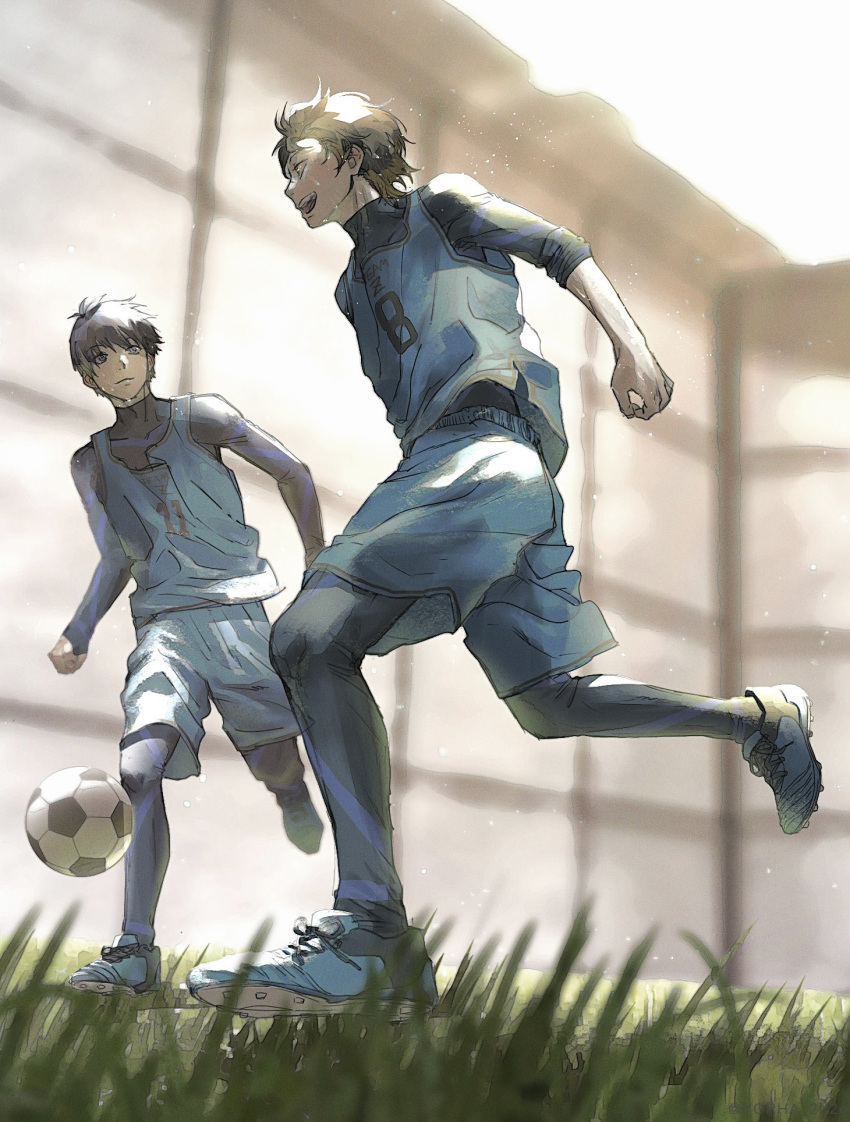 2boys bachira_meguru ball black_hair blue_footwear blue_lock blue_shirt blue_shorts blurry commentary depth_of_field grass highres isagi_yoichi male_focus multiple_boys running shirt shoes short_hair shorts sleeves_rolled_up smile soccer_ball soccer_uniform sportswear symbol-only_commentary yorha_2b2e