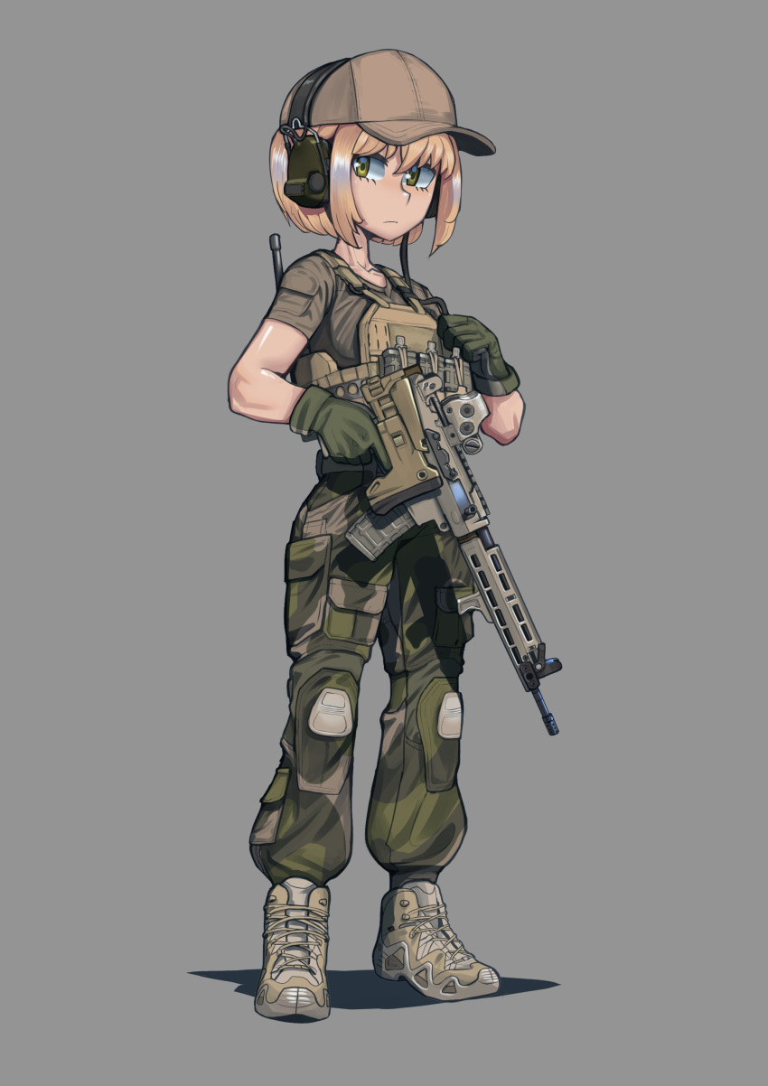 1girl absurdres assault_rifle baseball_cap blonde_hair boots brown_footwear brown_headwear brown_shirt bulletproof_vest camouflage camouflage_pants closed_mouth erica_(naze1940) folding_stock full_body gloves green_eyes green_gloves grey_background gun hat headphones highres looking_at_viewer original pants rifle shirt short_hair short_sleeves simple_background solo trigger_discipline weapon