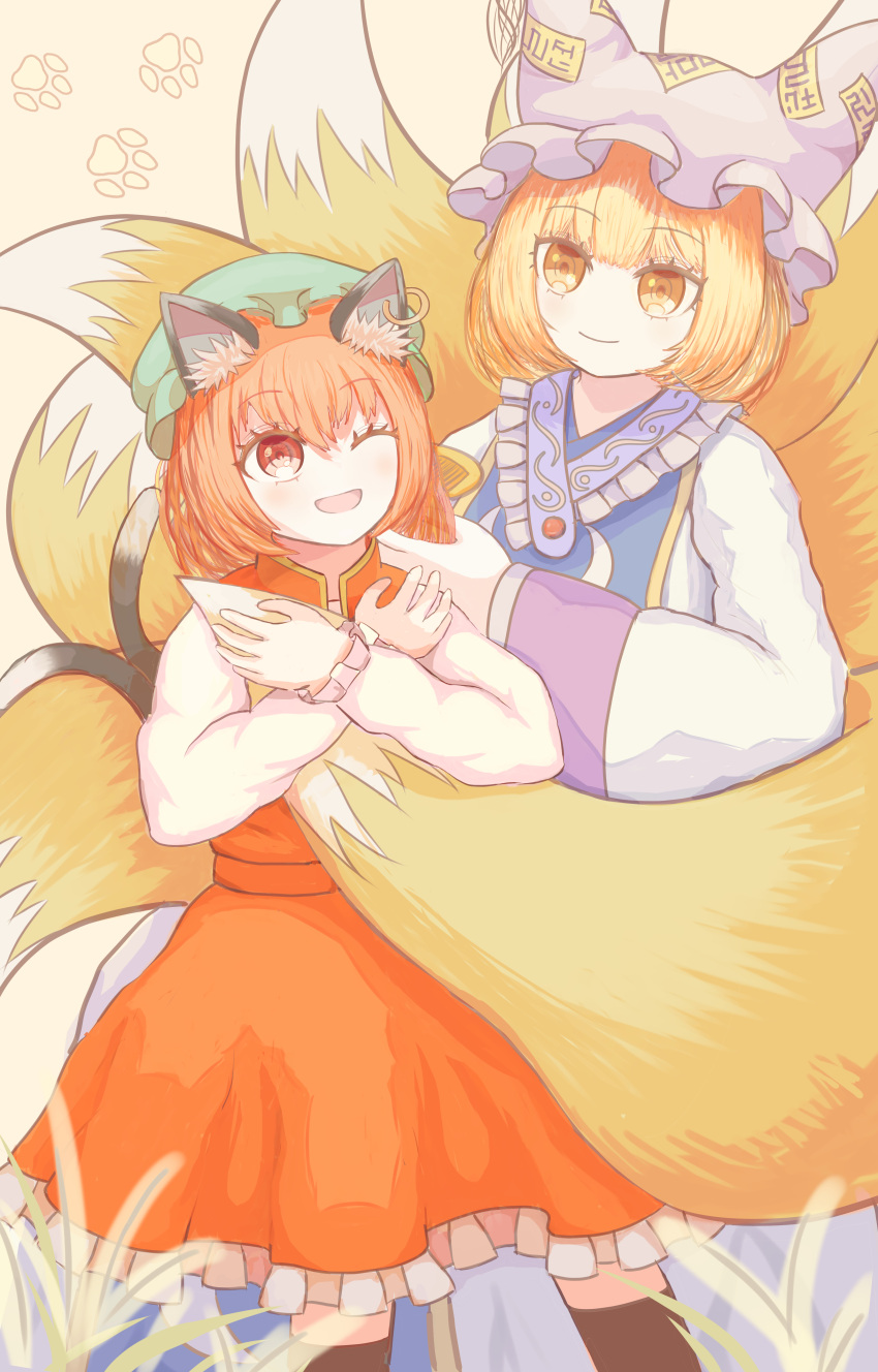 2girls ;d absurdres animal_ears blonde_hair brown_eyes brown_hair cat_day cat_ears cat_girl cat_tail chen commentary_request fox_tail green_headwear hat highres kitsune long_sleeves mob_cap multiple_girls multiple_tails one_eye_closed paw_print paw_print_background ro.ro short_hair smile tail touhou two_tails white_headwear yakumo_ran yellow_background yellow_eyes