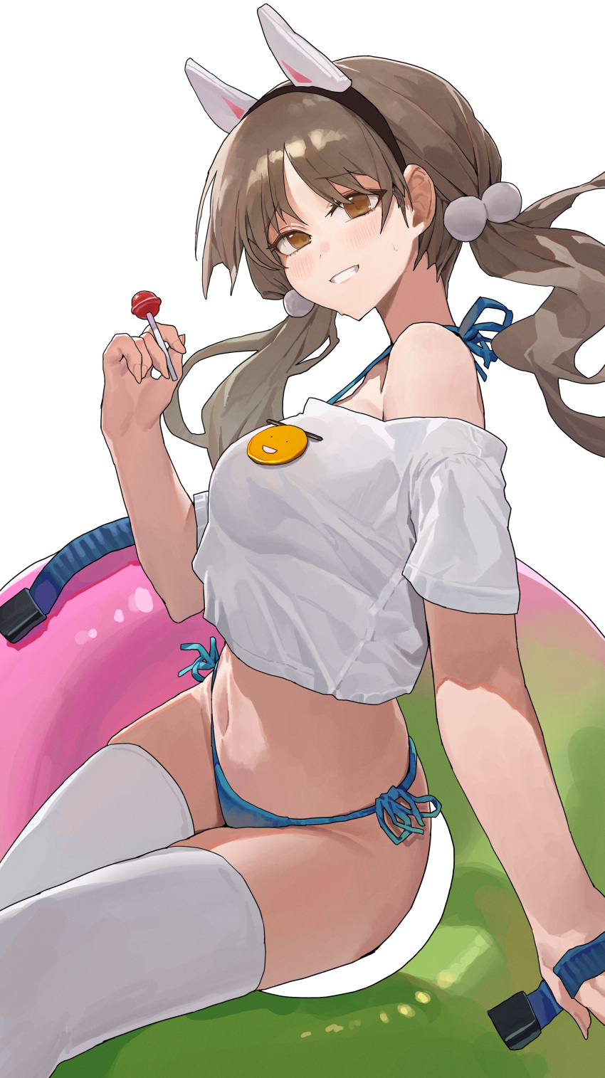 absurdres animal_ears bikini blue_archive blue_bikini blush breasts brown_hair candy cropped_shirt fake_animal_ears food grin highres holding holding_candy holding_food innertube lollipop medium_breasts moe_(blue_archive) pom_pom_(clothes) rabbit_ears shirt side-tie_bikini_bottom smile starshell swimsuit thighhighs twintails white_shirt white_thighhighs