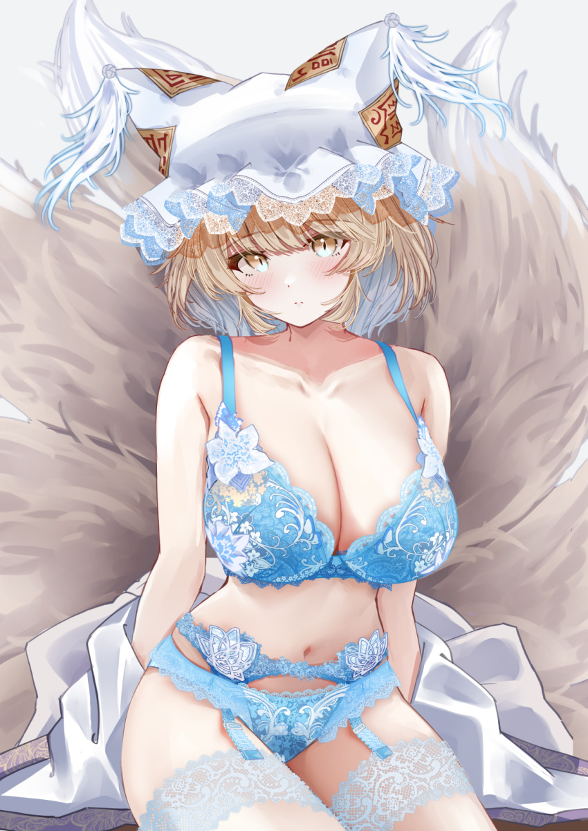 1girl animal_ear_headwear blonde_hair blue_bra blue_garter_belt blue_panties blue_theme blush bra breasts cleavage clothes_pull collarbone embroidered_bra embroidered_garter_belt embroidered_legwear embroidered_panties fox_tail hat highres kitsune kyuubi lace-trimmed_bra lace-trimmed_headwear lace-trimmed_panties lace-trimmed_thighhighs lace_trim large_breasts looking_at_viewer mob_cap multiple_tails navel panties sarasadou_dan shirt shirt_pull simple_background sitting solo tail touhou underwear white_background white_shirt yakumo_ran