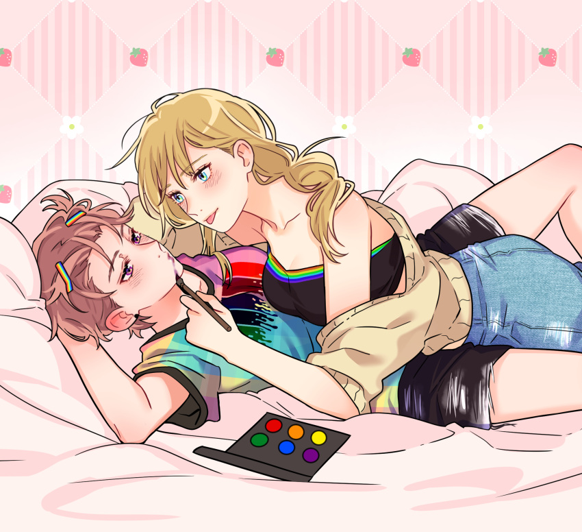 2girls applying_makeup black_shorts black_tube_top blonde_hair blue_eyes blush breasts brown_cardigan cardigan cosmetics curryuku denim eye_contact food fruit girl_on_top hair_tie hanna_schulerin highres jeans lesbians_doing_makeup_(meme) long_hair looking_at_another lying lying_on_person makeup_brush meme multiple_girls not_so_shoujo_love_story off_shoulder on_back palette_(object) pants pink_background rainbow_flag rainbow_hair_ornament rainbow_shirt rei_(not_so_shoujo_love_story) shirt short_hair short_sleeves shorts strapless strawberry t-shirt tongue tongue_out tube_top yuri