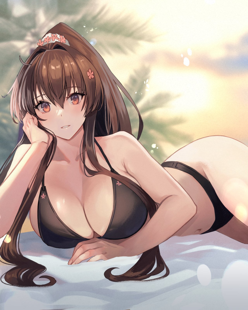1girl bare_shoulders bikini black_bikini blurry blurry_background breasts brown_eyes brown_hair cleavage cloud collarbone commentary flower hair_between_eyes hair_flower hair_intakes hair_ornament hand_on_own_cheek hand_on_own_face high_ponytail highres kantai_collection kasumi_(skchkko) large_breasts long_hair looking_at_viewer lying navel on_side on_stomach outdoors palm_tree parted_lips ponytail solo sunrise swimsuit thighs tree yamato_(kancolle)