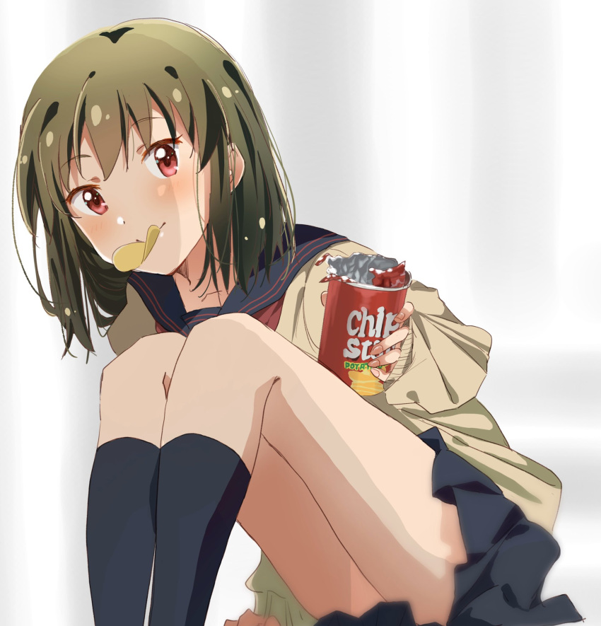 1girl arm_support black_sailor_collar black_skirt black_socks blurry blurry_background blush breasts brown_cardigan cardigan chip_star chips_(food) collarbone dot_nose food green_hair hand_up highres holding_snack ichigo_(berryberry_19) idolmaster idolmaster_million_live! idolmaster_million_live!_theater_days knees_up leaning_forward long_sleeves looking_at_viewer mouth_hold nagayoshi_subaru neckerchief pleated_skirt potato_chips reaching reaching_towards_viewer red_eyes red_neckerchief sailor_collar school_uniform serafuku short_hair sitting skirt sleeves_past_wrists small_breasts smile socks solo white_background