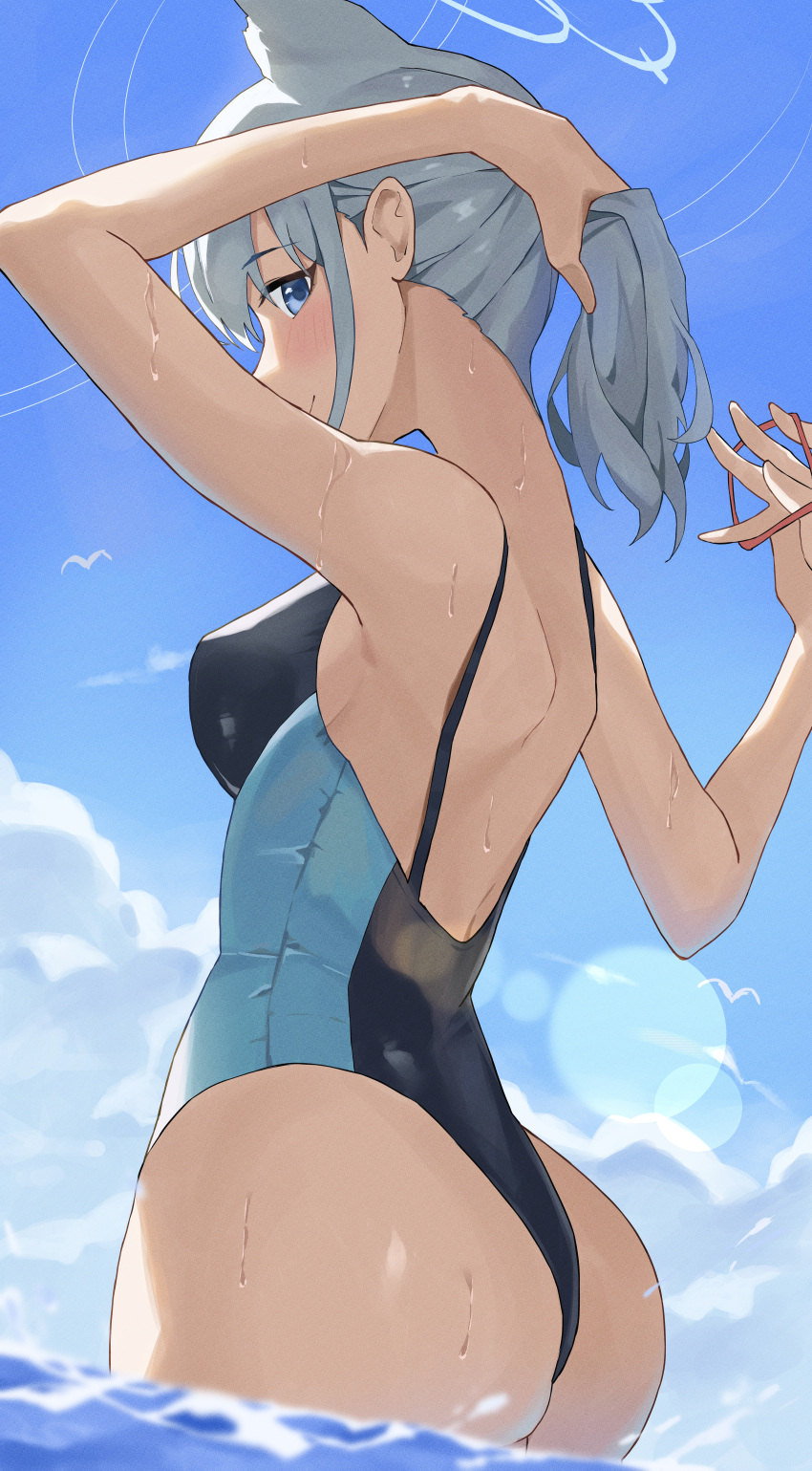 1girl absurdres animal_ears ass backless_swimsuit blue_archive blush breasts competition_swimsuit grey_hair halo higashiwun_izumi highres looking_at_viewer medium_breasts official_alternate_costume one-piece_swimsuit ponytail rubber_band shiroko_(blue_archive) shiroko_(swimsuit)_(blue_archive) sideways_glance smile solo swimsuit two-tone_one-piece_swimsuit tying_hair wading wolf_ears