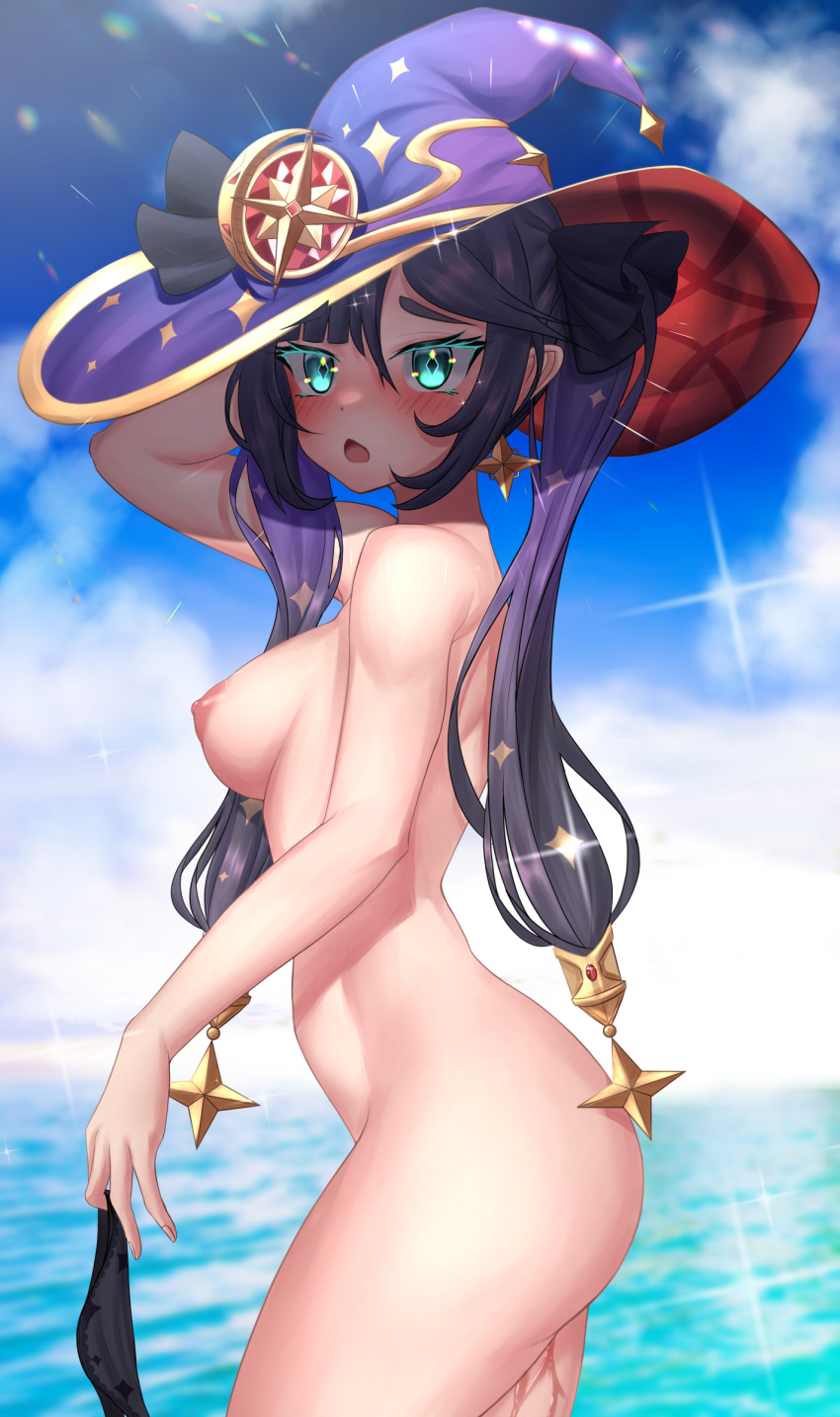 1girl absurdres arm_behind_head ass asymmetrical_hair bikini bikini_bottom_only bikini_bottom_removed black_bikini black_bow black_hair black_ribbon blue_headwear blue_sky blurry blurry_background blush bow breasts completely_nude earrings english_commentary facing_to_the_side from_side genshin_impact green_eyes hair_ornament hair_ribbon hat hat_bow highres holding holding_clothes holding_swimsuit jewelry long_hair looking_at_viewer medium_breasts mona_(genshin_impact) nipples nithros nude ocean open_mouth outdoors ribbon sideboob sky solo star_(symbol) star_earrings star_hair_ornament swimsuit twintails wet witch_hat