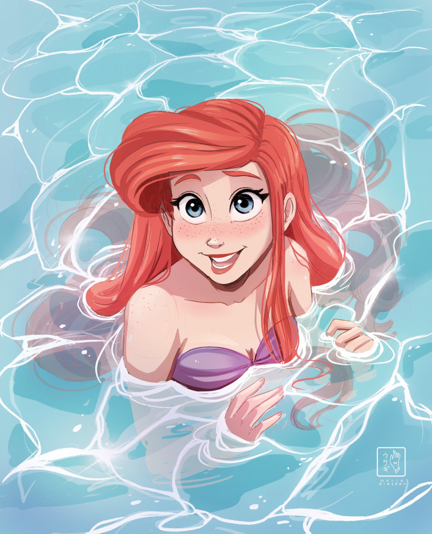 1girl ariel_(disney) artist_logo artist_name blue_eyes blush caustics freckles highres long_hair looking_at_viewer miadresden open_mouth partially_submerged red_hair shell shell_bikini solo teeth the_little_mermaid water watermark