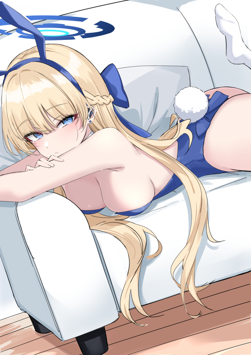 1girl animal_ears ass blonde_hair blue_archive blue_eyes blue_hairband blue_leotard breasts closed_mouth couch earpiece fake_animal_ears hairband halo highres ichiki_1 leotard long_hair looking_at_viewer lying medium_breasts on_couch on_stomach playboy_bunny rabbit_ears rabbit_tail sideboob socks solo tail toki_(blue_archive) toki_(bunny)_(blue_archive) white_socks