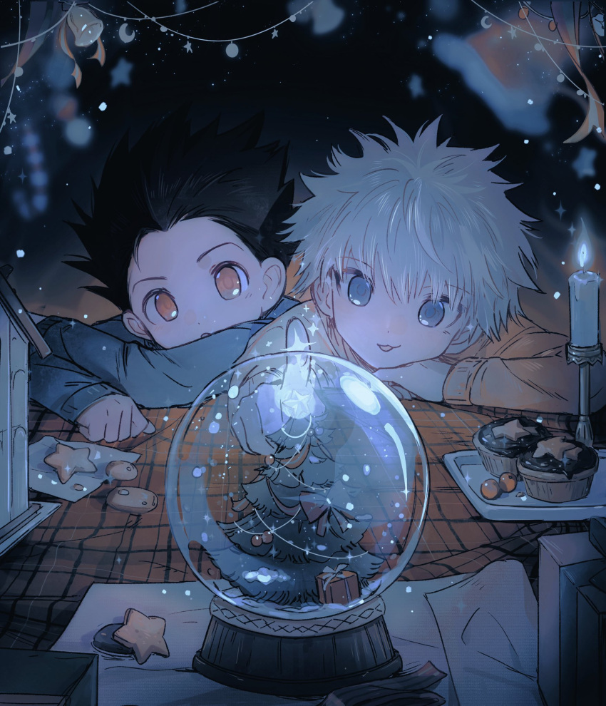 2boys black_hair blue_eyes candle christmas christmas_ornaments cookie food gon_freecss hair_between_eyes highres hunter_x_hunter kiko killua_zoldyck long_sleeves male_focus multiple_boys snow_globe sparkle spiked_hair star_(symbol) table upper_body white_hair