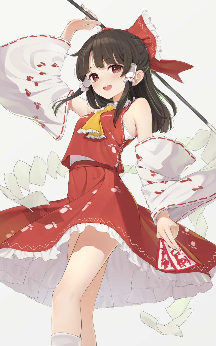1girl :d absurdres bare_legs bare_shoulders blush breasts brown_hair detached_sleeves from_below gohei hakurei_reimu highres holding holding_stick kanpa_(campagne_9) long_hair looking_at_viewer paw_print petticoat red_eyes red_skirt red_vest simple_background skirt skirt_set small_breasts smile solo stick touhou unfinished_dream_of_all_living_ghost vest white_background