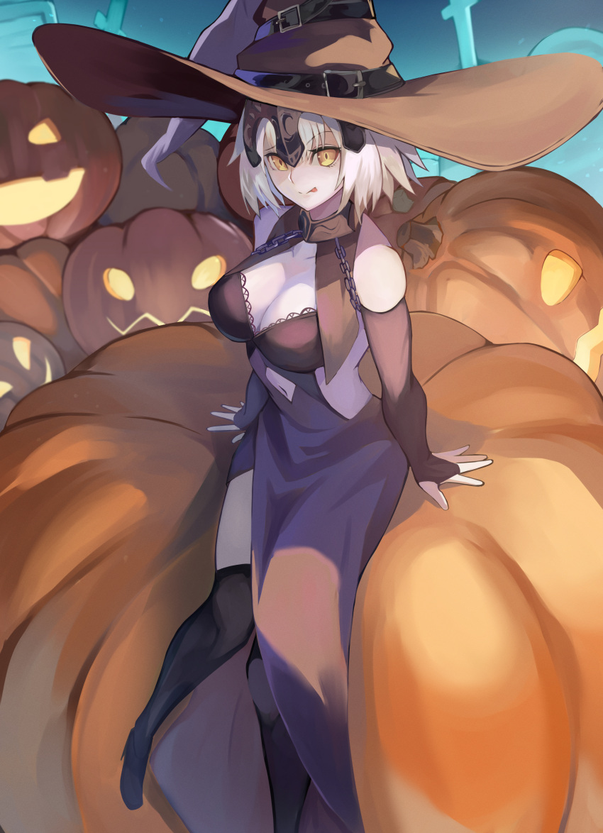 1girl absurdres bare_shoulders black_dress black_headwear black_thighhighs breasts bridal_gauntlets chain cleavage collar detached_sleeves dress fate/grand_order fate_(series) genshu_doki grey_hair hat headpiece highres jack-o'-lantern jeanne_d'arc_alter_(avenger)_(fate) jeanne_d'arc_alter_(fate) large_breasts looking_at_viewer metal_collar pumpkin short_hair sitting smile solo thighhighs tongue tongue_out witch_hat yellow_eyes