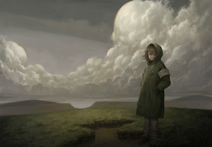 1girl absurdres armband badge brown_eyes brown_hair button_badge cloud coat commentary_request english_text full_body grass green_coat grey_sky hands_in_pockets highres hood hood_up hooded_coat long_sleeves looking_at_viewer medium_hair mountain original outdoors scenery sky solo standing subfiction