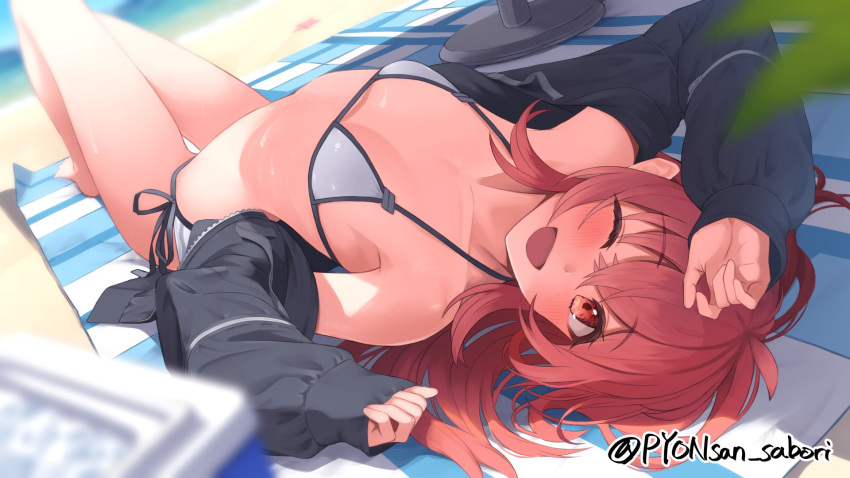 1girl ahoge arm_up barefoot beach bikini black_jacket blurry blurry_background blurry_foreground blush breasts checkered_blanket collarbone commentary day dot_nose eyelashes hair_between_eyes highres idolmaster idolmaster_shiny_colors jacket komiya_kaho legs long_hair long_sleeves looking_at_viewer lying ocean one_eye_closed open_clothes open_jacket open_mouth outdoors pyonsan red_eyes red_hair shadow side-tie_bikini_bottom sidelocks small_breasts smile solo stomach swimsuit thighs track_jacket twitter_username white_bikini
