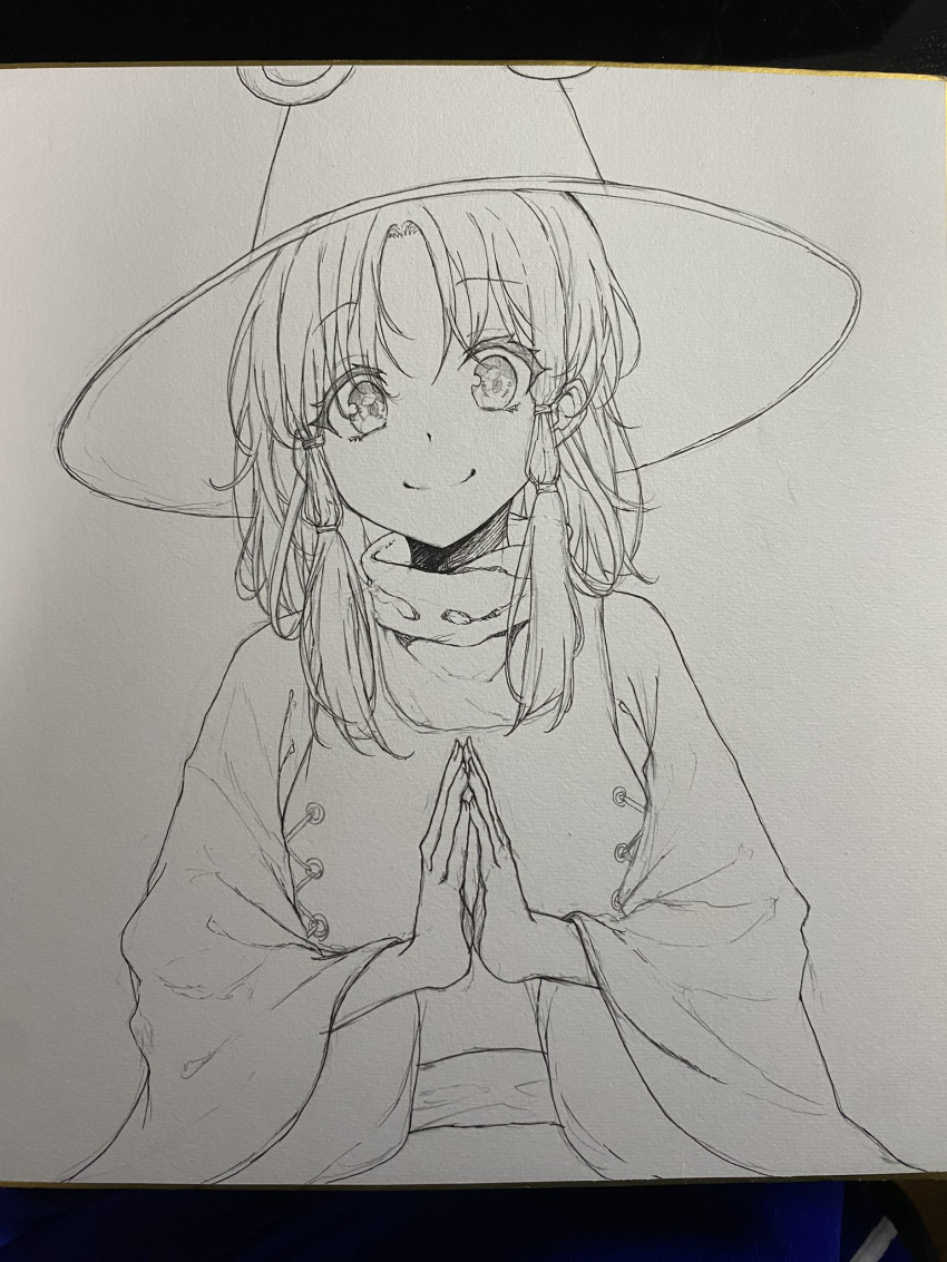 1girl closed_mouth commentary_request greyscale hat hegata_(hegatia_lapis) highres long_sleeves looking_at_viewer medium_hair monochrome moriya_suwako own_hands_together parted_bangs sidelocks smile solo touhou traditional_media upper_body wide_sleeves