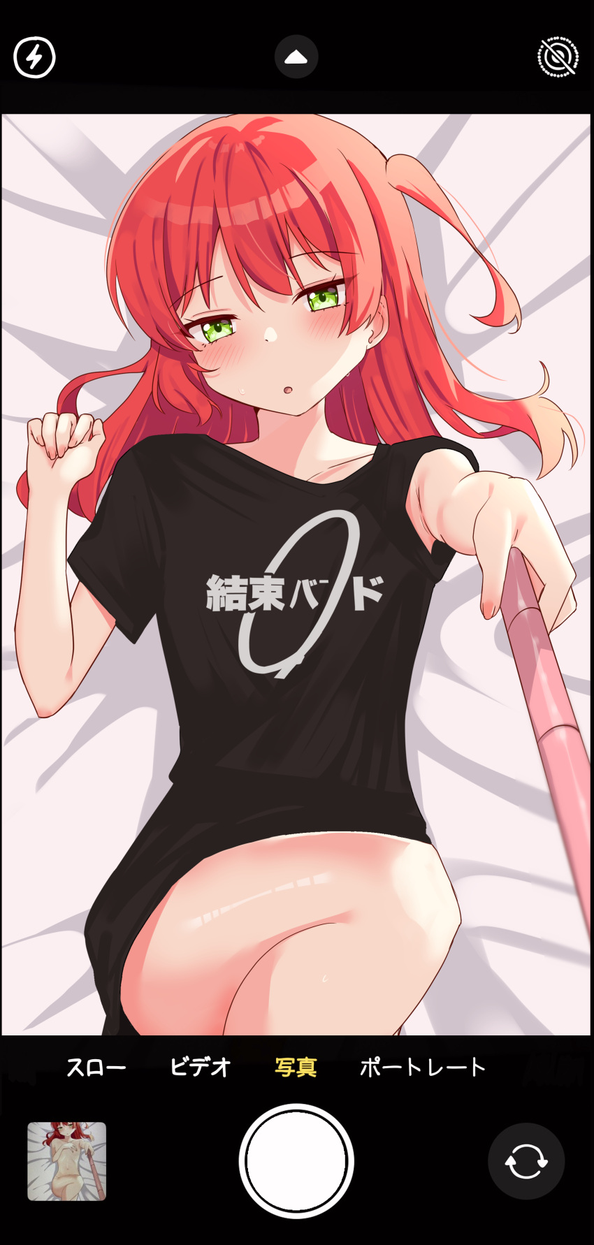 1girl :o absurdres ao_(flowerclasse) arrow_(symbol) bed_sheet black_shirt blush bocchi_the_rock! cellphone_display clothes_writing covering covering_chest feet_out_of_frame flat_chest green_eyes hair_between_eyes half-closed_eyes highres holding kita_ikuyo knee_up lightning_bolt_symbol long_hair looking_at_viewer lying navel nude on_back one_side_up parted_lips red_hair selfie selfie_stick shirt short_sleeves solo