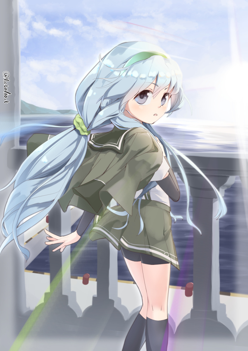 1girl arm_warmers bike_shorts_under_skirt black_socks blue_sky cloud feet_out_of_frame from_behind grey_eyes grey_hair grey_jacket grey_sailor_collar grey_skirt highres horizon jacket jacket_on_shoulders kantai_collection long_hair looking_at_viewer looking_back low_ponytail metadio ocean railing sailor_collar shirt shorts shorts_under_skirt sidelocks skirt sky socks solo sunrise wavy_hair white_shirt yamagumo_(kancolle)