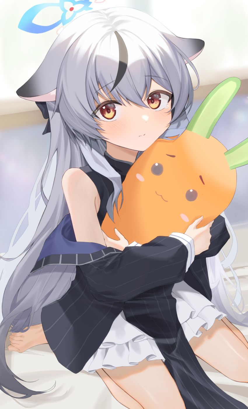 animal_ears arm_out_of_sleeve barefoot bed bed_sheet black_coat blue_archive blurry chinese_clothes coat depth_of_field doll_hug frilled_skirt frills grey_hair halo highres indoors kokona_(blue_archive) misononasubi multicolored_hair object_hug orange_eyes pelvic_curtain sitting skirt streaked_hair stuffed_carrot tearing_up tiger_ears tiger_girl toes two-tone_hair wariza