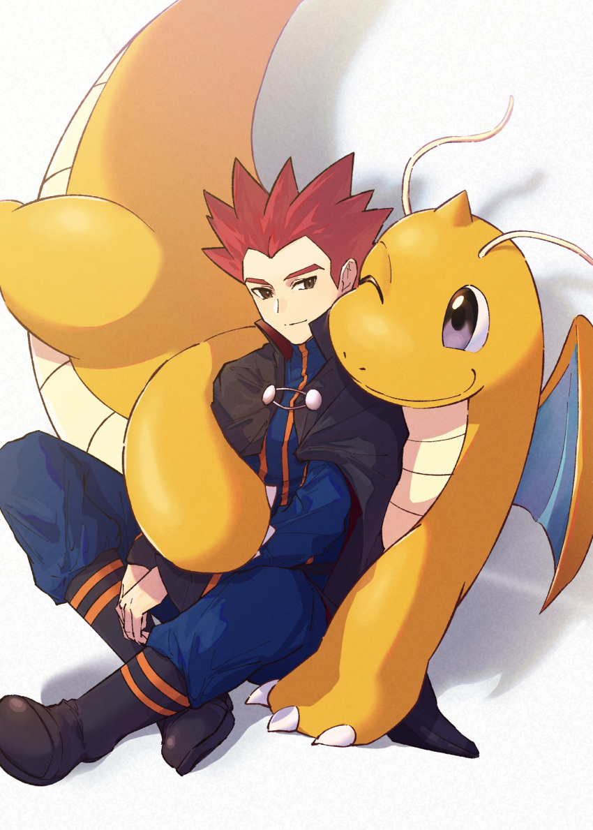 1boy anidf black_cape blue_jacket blue_pants boots cape claws closed_mouth commentary_request dragonite highres jacket lance_(pokemon) long_sleeves male_focus own_hands_together pants pokemon pokemon_(creature) pokemon_hgss popped_collar red_hair short_hair sitting smile spiked_hair