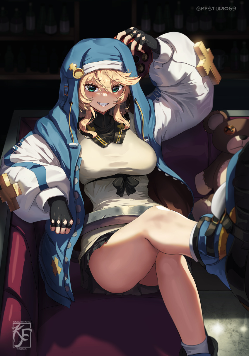 1girl absurdres artist_logo artist_name black_gloves black_ribbon black_skirt blonde_hair blue_footwear blue_hoodie breasts bridget_(guilty_gear) couch cross fingerless_gloves genderswap genderswap_(mtf) gloves green_eyes guilty_gear habit hand_up highres hood hoodie knightfang large_breasts long_sleeves on_couch pleated_skirt puffy_long_sleeves puffy_sleeves ribbon skirt smile socks solo stuffed_animal stuffed_toy teddy_bear thighs twitter_username two-tone_hoodie venus_symbol white_socks zipper zipper_pull_tab