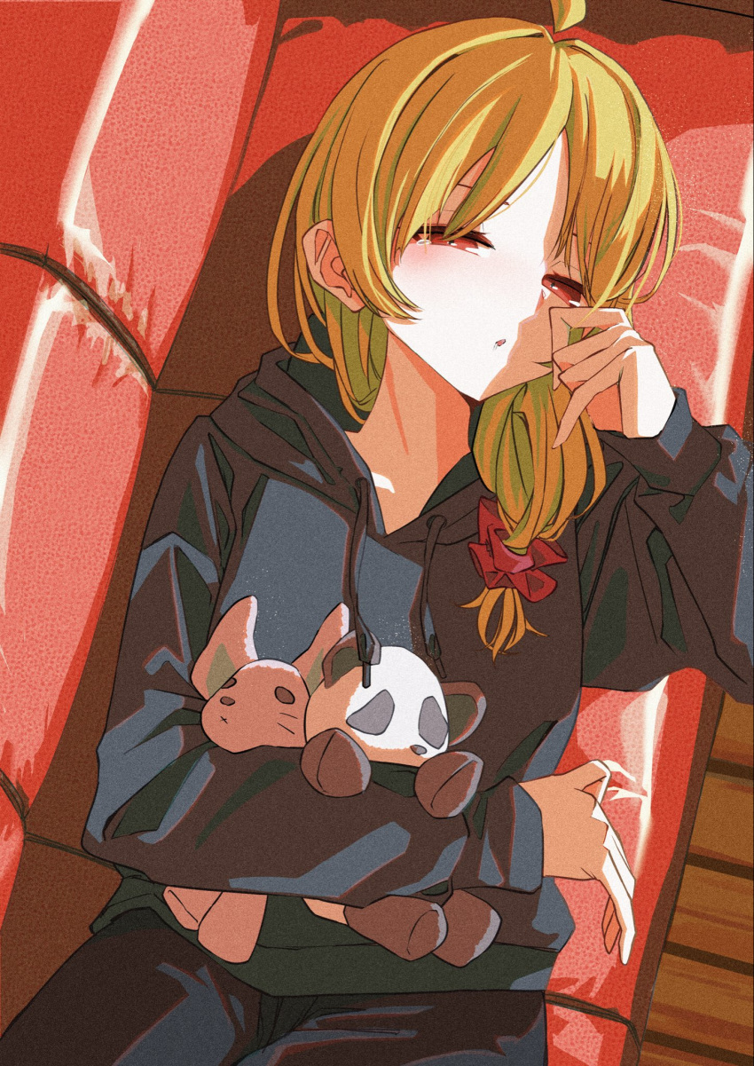 1girl ahoge bachiboko_l3 black_hoodie blonde_hair bocchi_the_rock! couch detached_ahoge hair_ornament hair_scrunchie highres holding holding_stuffed_toy hood hoodie ijichi_seika long_hair long_sleeves looking_at_viewer on_couch parted_lips red_eyes red_scrunchie scrunchie single_tear solo stuffed_animal stuffed_panda stuffed_rabbit stuffed_toy teardrop upper_body waking_up