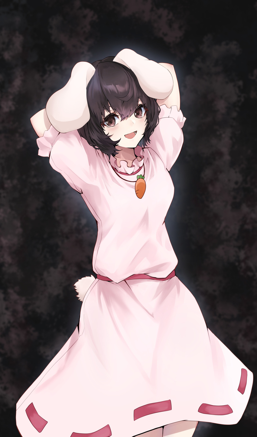 1girl :d absurdres animal_ears black_hair breasts brown_eyes carrot_necklace cowboy_shot dark_background dress floppy_ears hair_between_eyes highres inaba_tewi jewelry looking_at_viewer lower_teeth_only necklace open_mouth pink_dress puffy_short_sleeves puffy_sleeves purple_eyes rabbit_ears rabbit_tail short_hair short_sleeves simple_background small_breasts smile solo tail teeth touhou yagoro_kusuriya