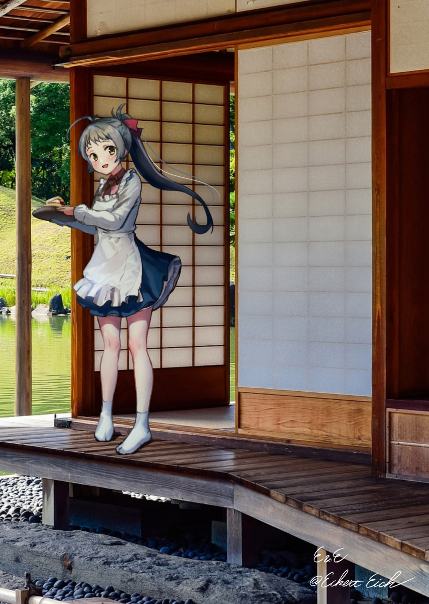 1girl apron blue_skirt commentary_request day eckert&amp;eich green_eyes green_hair highres irako_(kancolle) kantai_collection kappougi long_hair looking_at_viewer one-hour_drawing_challenge outdoors photo_background pleated_skirt pond ponytail skirt sliding_doors solo standing tray veranda wooden_floor