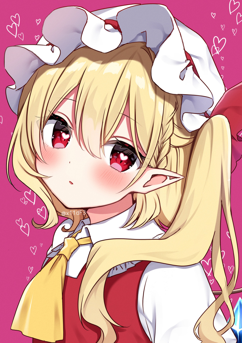 1girl ascot blonde_hair blush collared_shirt crystal flandre_scarlet hair_between_eyes hat heart highres long_hair mob_cap one_side_up parted_lips pink_background pointy_ears red_eyes red_vest shinonome_asu shirt simple_background solo touhou twitter_username vest white_headwear white_shirt wings yellow_ascot