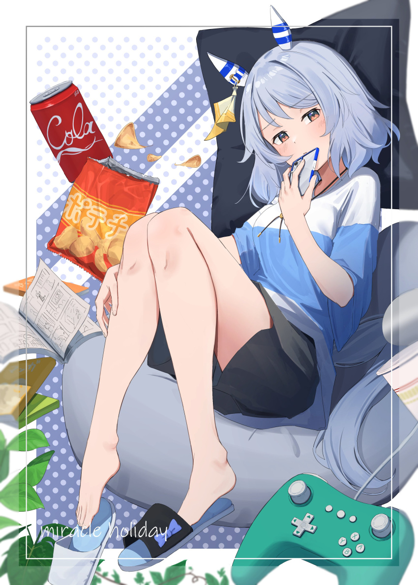 1girl absurdres animal_ears barefoot black_shorts brown_eyes can cellphone chips_(food) cidersour controller ear_covers food full_body game_controller grey_hair highres hishi_miracle_(umamusume) holding holding_phone horse_ears horse_girl horse_tail looking_at_viewer lying manga_(object) medium_hair phone potato_chips shorts slippers smartphone solo tail two-tone_sweater umamusume