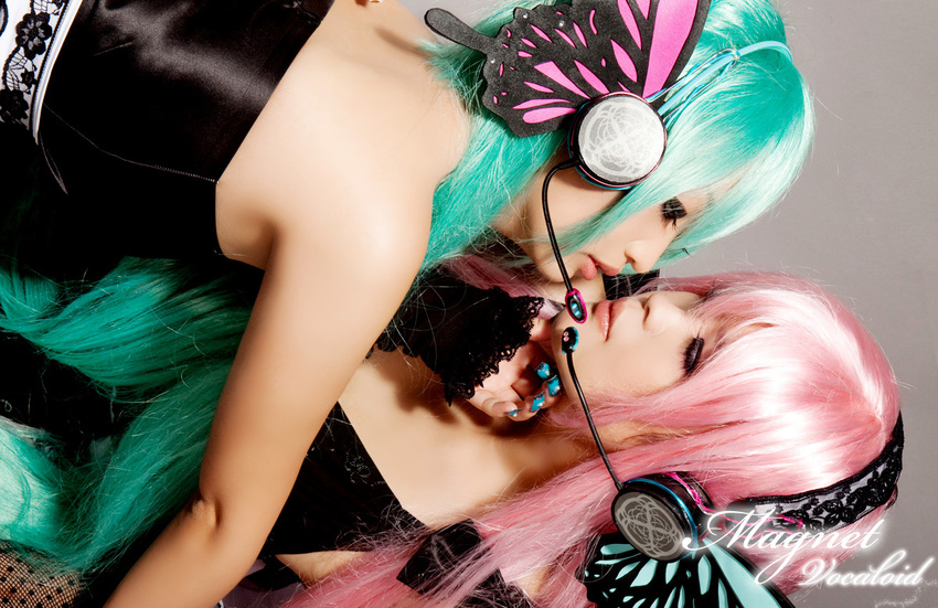 cosplay hatsune_miku long_hair magnet_(vocaloid) megurine_luka multiple_girls photo vocaloid
