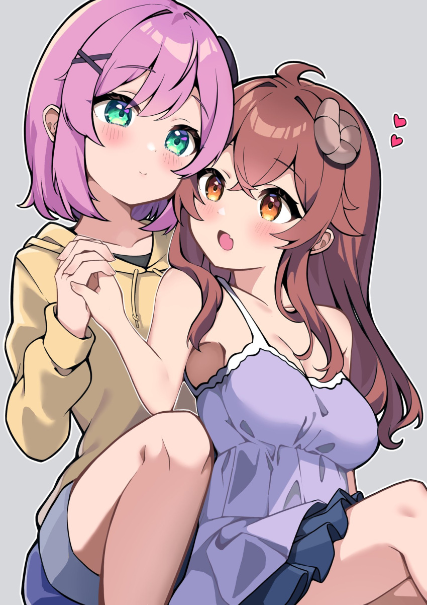 2girls :d ahoge bare_arms between_legs blue_dress blush breasts brown_eyes brown_hair chiyoda_momo cleavage closed_mouth collarbone commentary couple crossed_bangs curled_horns demon_girl demon_horns dress eyelashes feet_out_of_frame green_eyes grey_background hair_between_eyes hair_ornament hand_up happy heart highres holding_hands hood hood_down hoodie horns hug interlocked_fingers knee_up large_breasts long_hair looking_at_another machikado_mazoku multiple_girls nokia_hiyou open_mouth pink_hair short_dress short_hair simple_background sitting sleeveless sleeveless_dress smile x_hair_ornament yellow_hoodie yoshida_yuuko_(machikado_mazoku) yuri