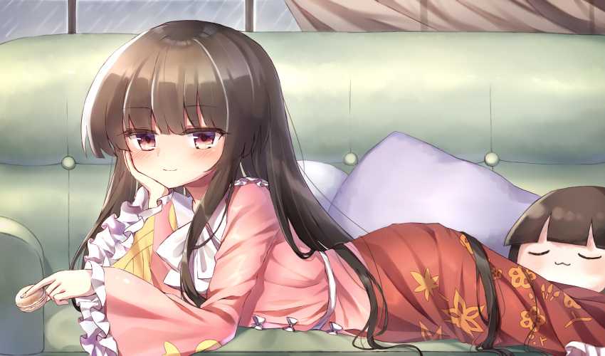 1girl :3 bangs blush bow brown_eyes brown_hair couch curtains eyebrows_visible_through_hair feet_out_of_frame floral_print food frilled_sleeves frills head_in_hand highres holding holding_food houraisan_kaguya indoors japanese_clothes light_smile long_hair looking_at_viewer lying macaron on_stomach pillow pink_shirt pudding_(skymint_028) rain red_skirt shiny shiny_hair shirt sidelocks skirt solo touhou very_long_hair white_bow window yukkuri_shiteitte_ne