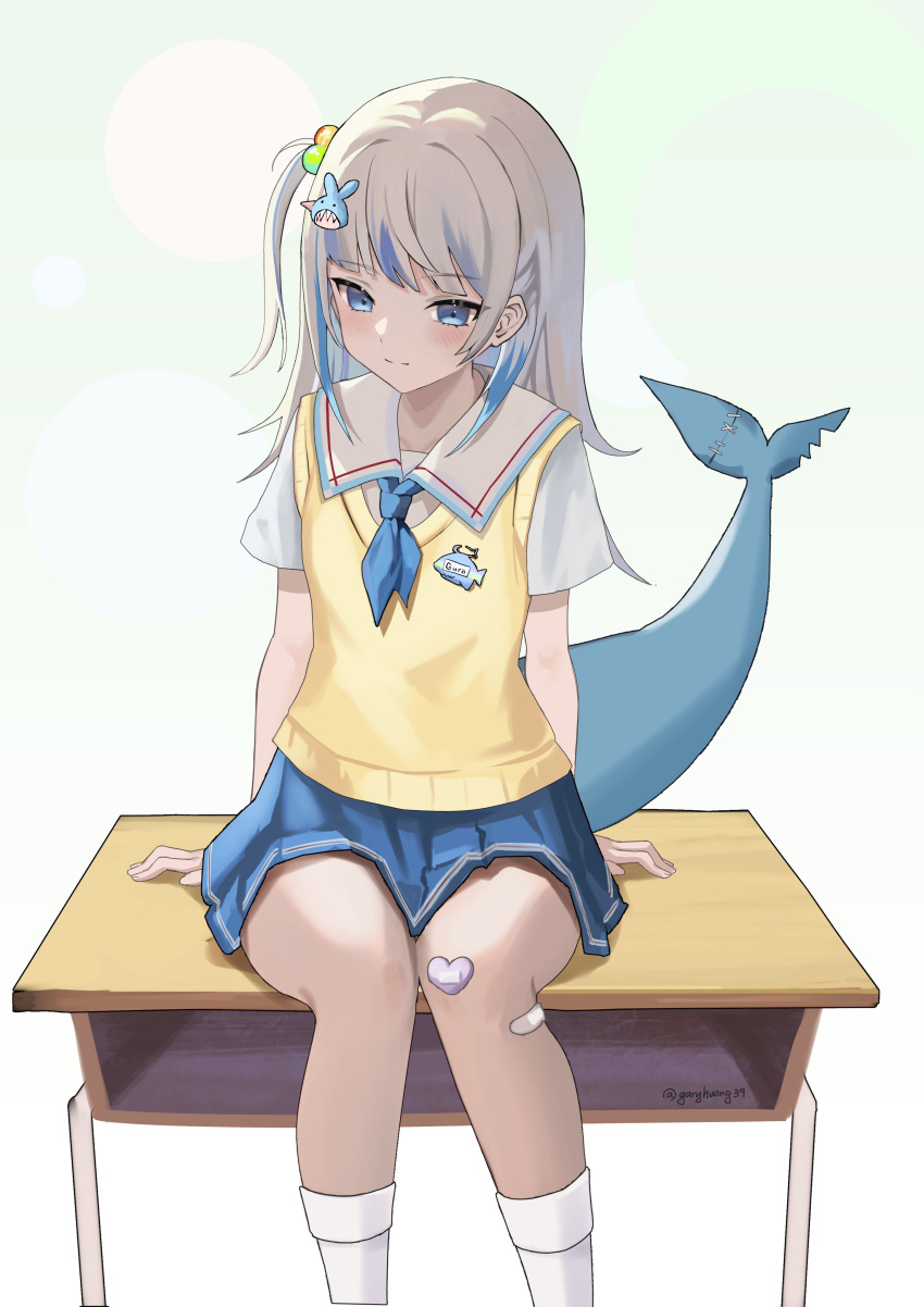 1girl absurdres bandaid bandaid_on_leg blue_eyes blue_hair blue_skirt blush closed_mouth commentary desk feet_out_of_frame fins fish_tail gary_huang gawr_gura gawr_gura_(school_uniform) gradient_background green_background grey_hair hair_bobbles hair_ornament highres hololive hololive_english light_smile multicolored_hair official_alternate_costume on_desk one_side_up pleated_skirt school_desk school_uniform shark_tail shirt short_sleeves sitting sitting_on_desk skirt socks solo streaked_hair sweater_vest tail twitter_username virtual_youtuber white_background white_shirt white_socks