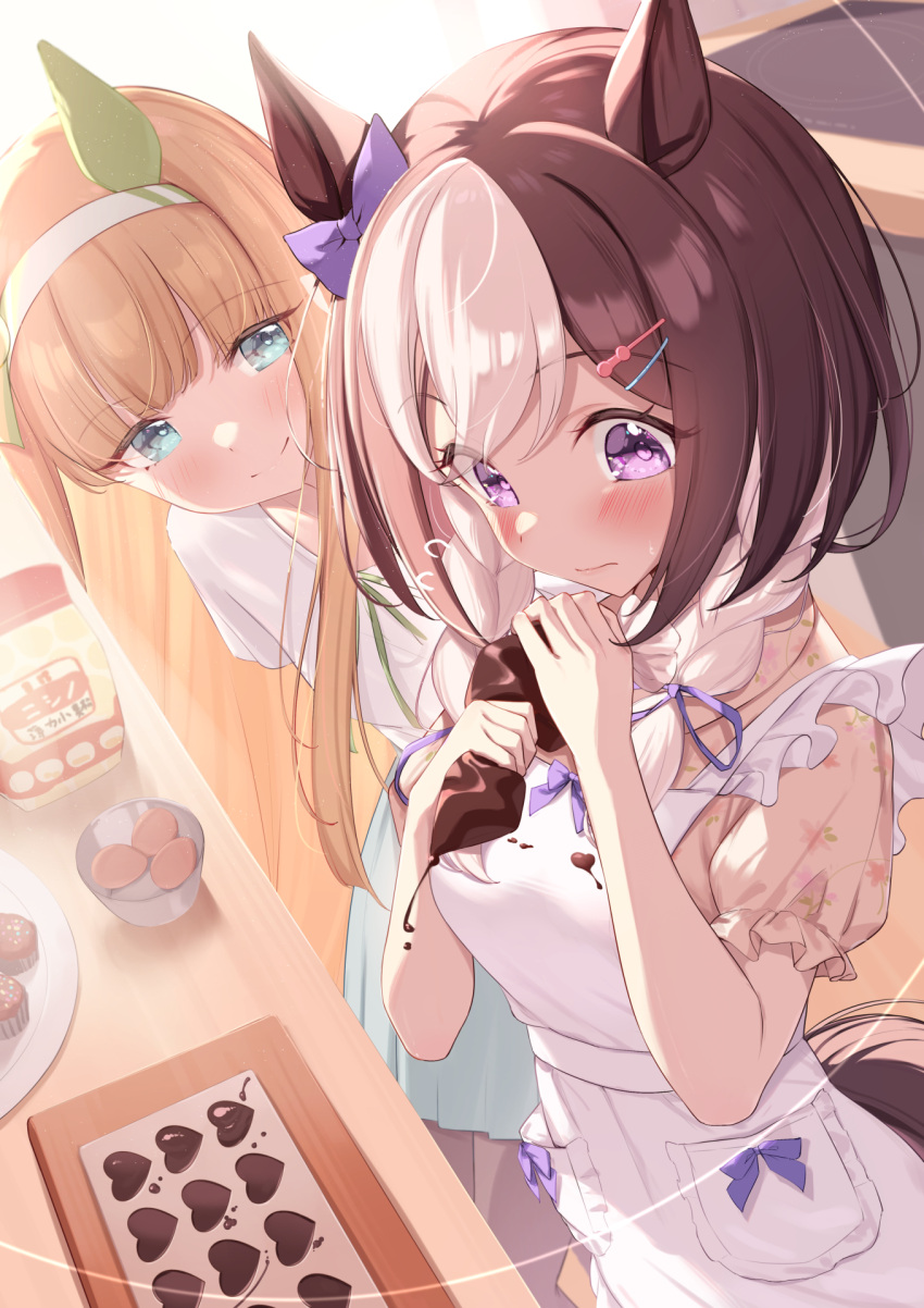 2girls animal_ears apron aqua_eyes bow brown_hair candy chocolate chocolate_on_clothes closed_mouth commentary_request ear_bow ear_covers food hairband heart heart-shaped_chocolate highres horse_ears horse_girl horse_tail long_hair looking_at_another multicolored_hair multiple_girls orange_hair purple_bow purple_eyes saboten_mushi short_hair silence_suzuka_(umamusume) smile special_week_(umamusume) tail two-tone_hair umamusume white_apron white_hair white_hairband
