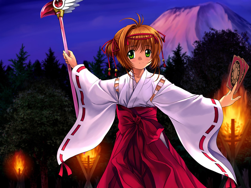 blush brown_hair card cardcaptor_sakura clow_card fuuin_no_tsue green_eyes hakama holding holding_card japanese_clothes kinomoto_sakura magical_girl miko mutsuki_(moonknives) red_hakama solo wand