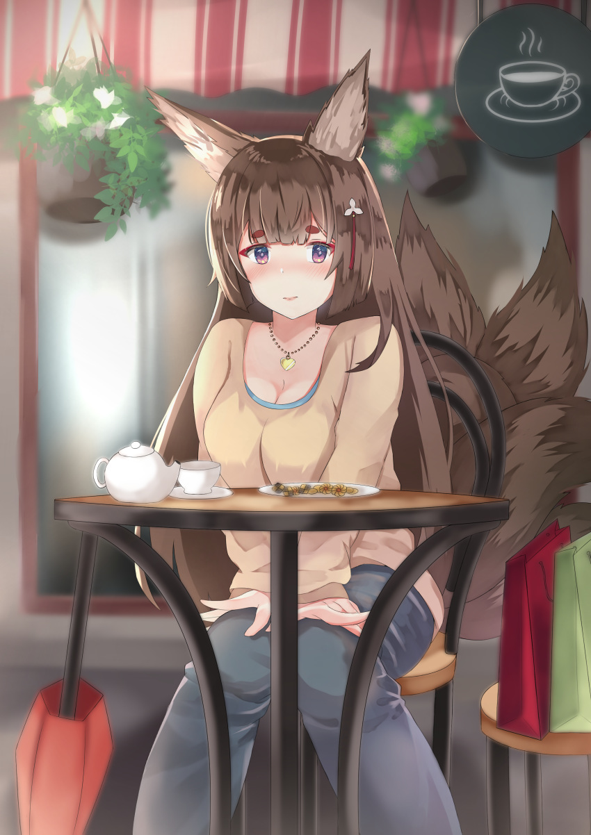 1girl absurdres amagi_(azur_lane) animal_ears awning azur_lane bag bangs blue_eyes blue_pants blurry blush breasts brown_hair brown_shirt cafe casual chair checkerboard_cookie cleavage closed_umbrella commentary contemporary cookie cup depth_of_field eyebrows_visible_through_hair feet_out_of_frame food fox_ears fox_tail hair_ornament hands_on_lap hanging_plant highres jewelry knees_together_feet_apart light_smile looking_at_viewer medium_breasts multiple_tails necklace pants plant plate potted_plant red_umbrella saucer shirt shirt_under_shirt shopping_bag sitting solo storefront sylux table tail teacup teapot thick_eyebrows umbrella window