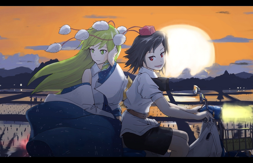 black_hair buncha_to_imon detached_sleeves green_eyes green_hair ground_vehicle hat kochiya_sanae letterboxed long_hair motor_vehicle multiple_girls pom_pom_(clothes) red_eyes rice_paddy scooter shameimaru_aya short_hair sunset tokin_hat touhou