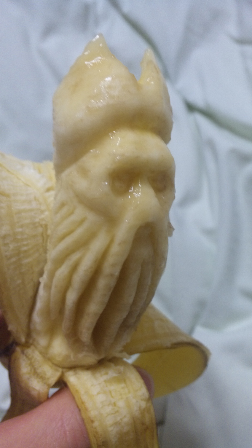 banana davy_jones food fruit highres holding photo pirates_of_the_caribbean sculpture tentacle y_yamaden