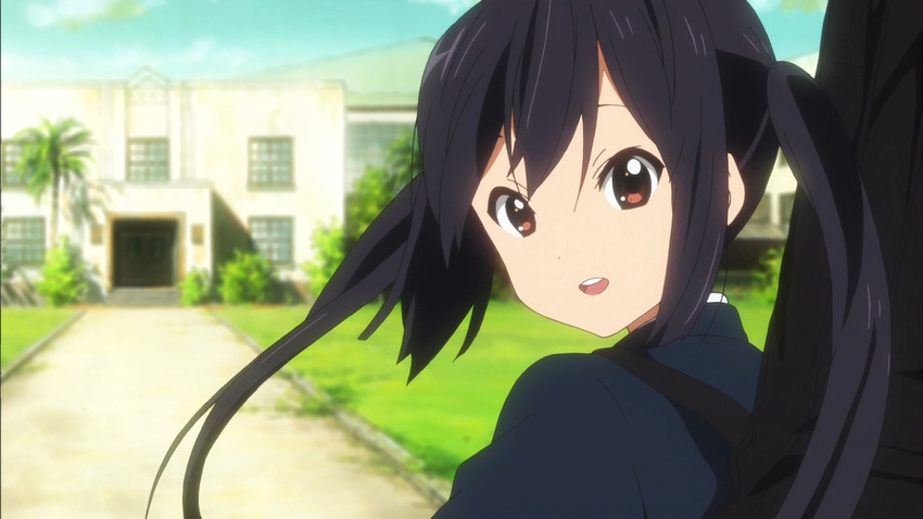 :d black_hair blue_sky building day from_behind grass guitar_case instrument_case k-on! long_hair looking_at_viewer looking_back nakano_azusa open_mouth outdoors palm_tree path red_eyes road round_teeth screencap sky smile solo tareme teeth tree twintails