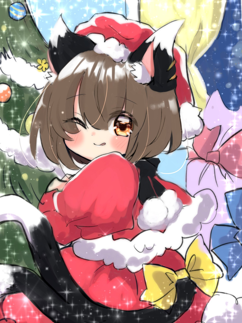 1girl ;q alternate_costume animal_ear_fluff animal_ears blush bow brown_eyes brown_hair capelet cat_ears cat_tail chen christmas_tree commentary_request forked_tail fur_trim hand_up hat highres nekomata ol07469724 one_eye_closed red_capelet santa_costume santa_hat sleeves_past_fingers sleeves_past_wrists solo sparkle tail tail_bow tail_ornament tongue tongue_out touhou yellow_bow