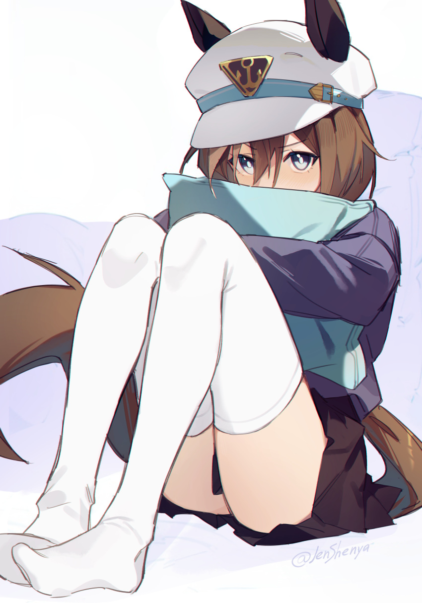 1girl absurdres animal_ears blue_eyes brown_hair brown_skirt cheval_grand_(umamusume) commentary ear_covers ears_through_headwear hair_between_eyes hat highres holding holding_pillow horse_ears horse_girl horse_tail jenshenya looking_at_viewer pillow short_hair sitting skirt solo tail thighhighs umamusume white_headwear white_thighhighs