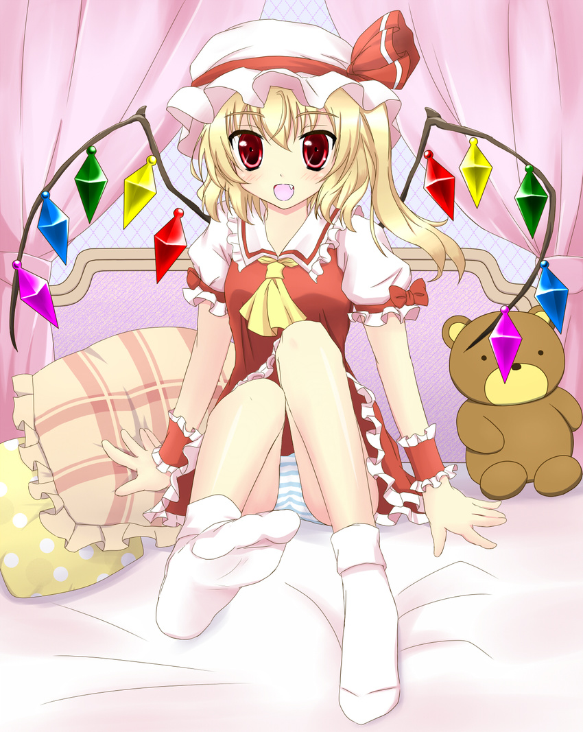 ascot bed blonde_hair blush canopy_bed dress fang feet flandre_scarlet highres open_mouth panties pillow red_dress red_eyes side_ponytail sitting smile socks solo striped striped_panties stuffed_animal stuffed_toy teddy_bear toni_(artist) touhou underwear upskirt wings wrist_cuffs