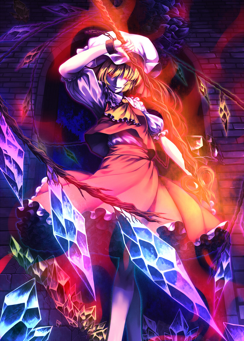 absurdres ascot blonde_hair chain cuffs flandre_scarlet frilled_skirt frills glowing glowing_eyes grin hat highres laevatein looking_at_viewer medium_skirt red_eyes red_skirt shackles sharp_teeth short_hair side_ponytail skirt skirt_set smile solo teeth touhou tro weapon wings