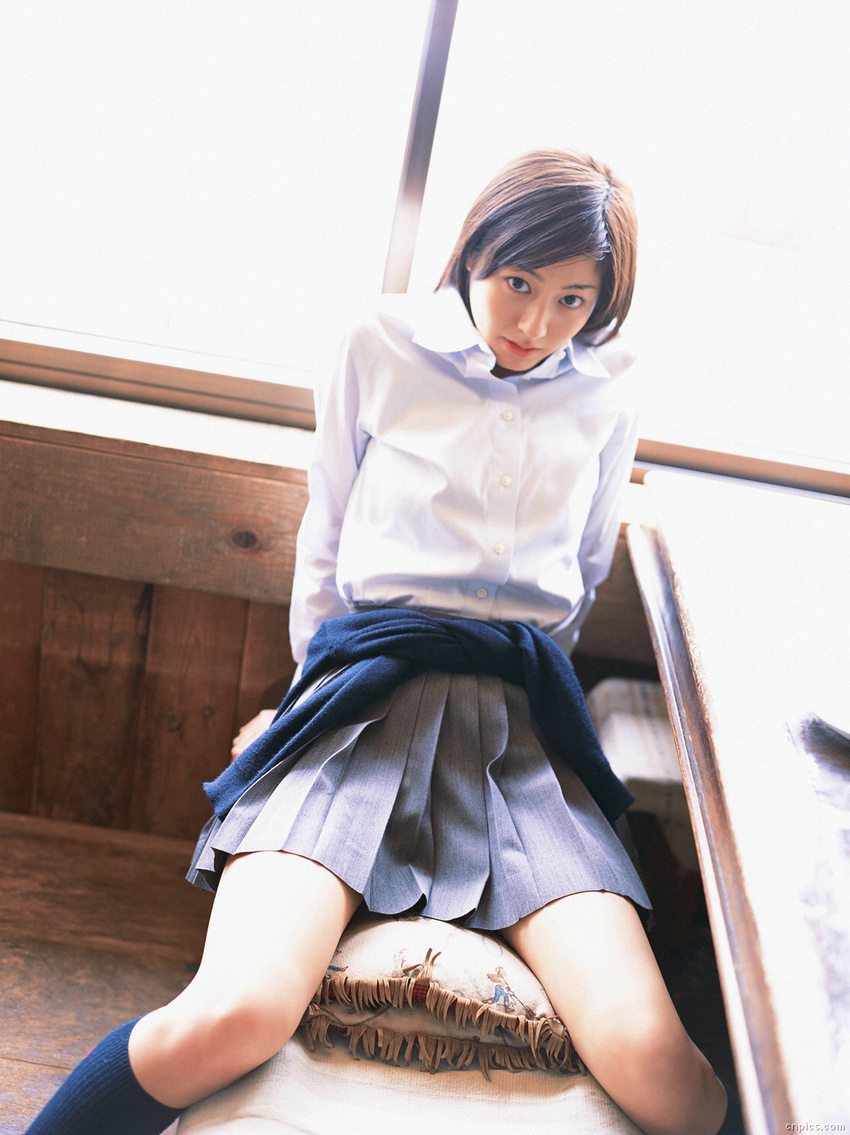 1girl asian brown_hair cardigan cosplay dutch_angle highres indoors knee_socks kneehighs long_hair looking_at_viewer miniskirt photo pleated_skirt school_uniform serafuku sitting skirt socks solo sugimoto_yumi