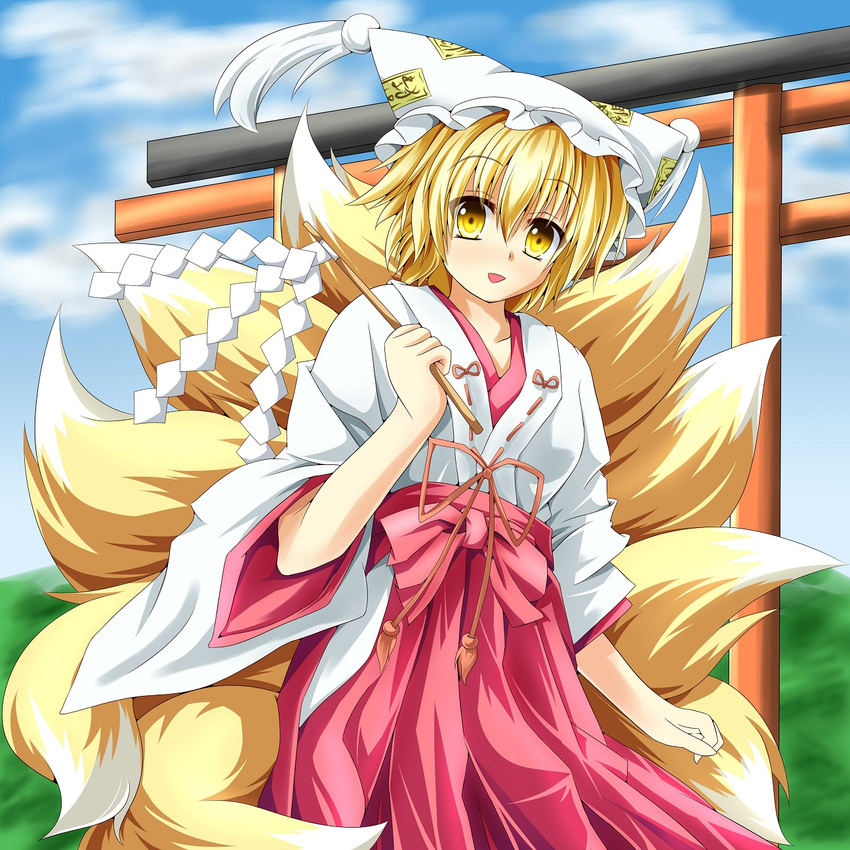 alternate_costume animal_ears bad_id bad_pixiv_id blonde_hair fox_tail gohei hat highres japanese_clothes kmkm9696 miko multiple_tails oonusa open_mouth short_hair smile solo tail torii touhou yakumo_ran yellow_eyes