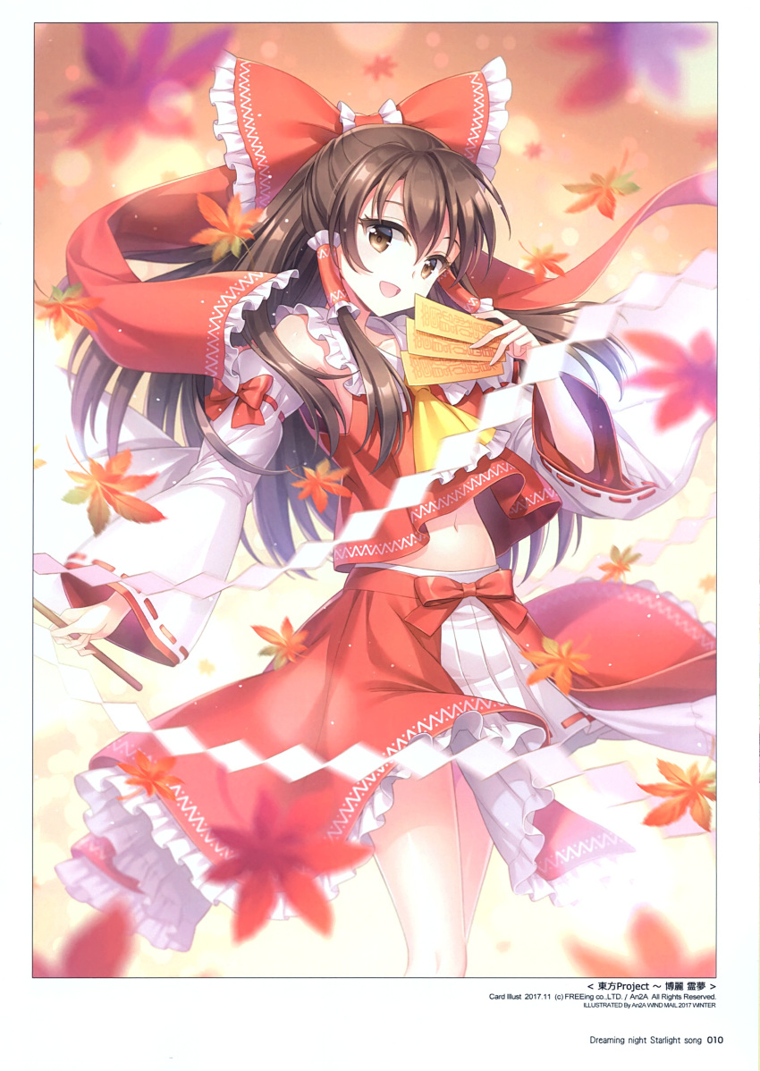 1girl absurdres an2a artist_name autumn autumn_leaves bangs bow brown_eyes brown_hair copyright_name detached_sleeves hair_bow hair_ornament hair_tubes hakurei_reimu highres holding japanese_clothes leaf long_hair looking_at_viewer navel official_art ofuda open_mouth ribbon ribbon-trimmed_sleeves ribbon_trim scan simple_background skirt sleeveless smile solo stomach touhou wide_sleeves