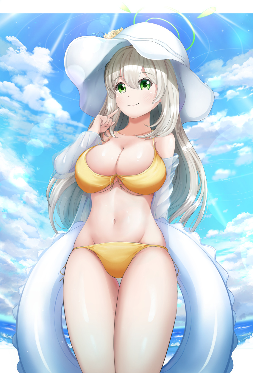 1girl absurdres bikini blue_archive blue_sky blush breasts cleavage closed_mouth cloud commentary_request cowboy_shot day drawing_rak flower green_eyes halo hat hat_flower highres index_finger_raised innertube jacket large_breasts light_brown_hair long_hair navel nonomi_(blue_archive) nonomi_(swimsuit)_(blue_archive) ocean official_alternate_costume outdoors see-through see-through_jacket sidelocks sky smile solo sun_hat swim_ring swimsuit thighs white_headwear yellow_bikini