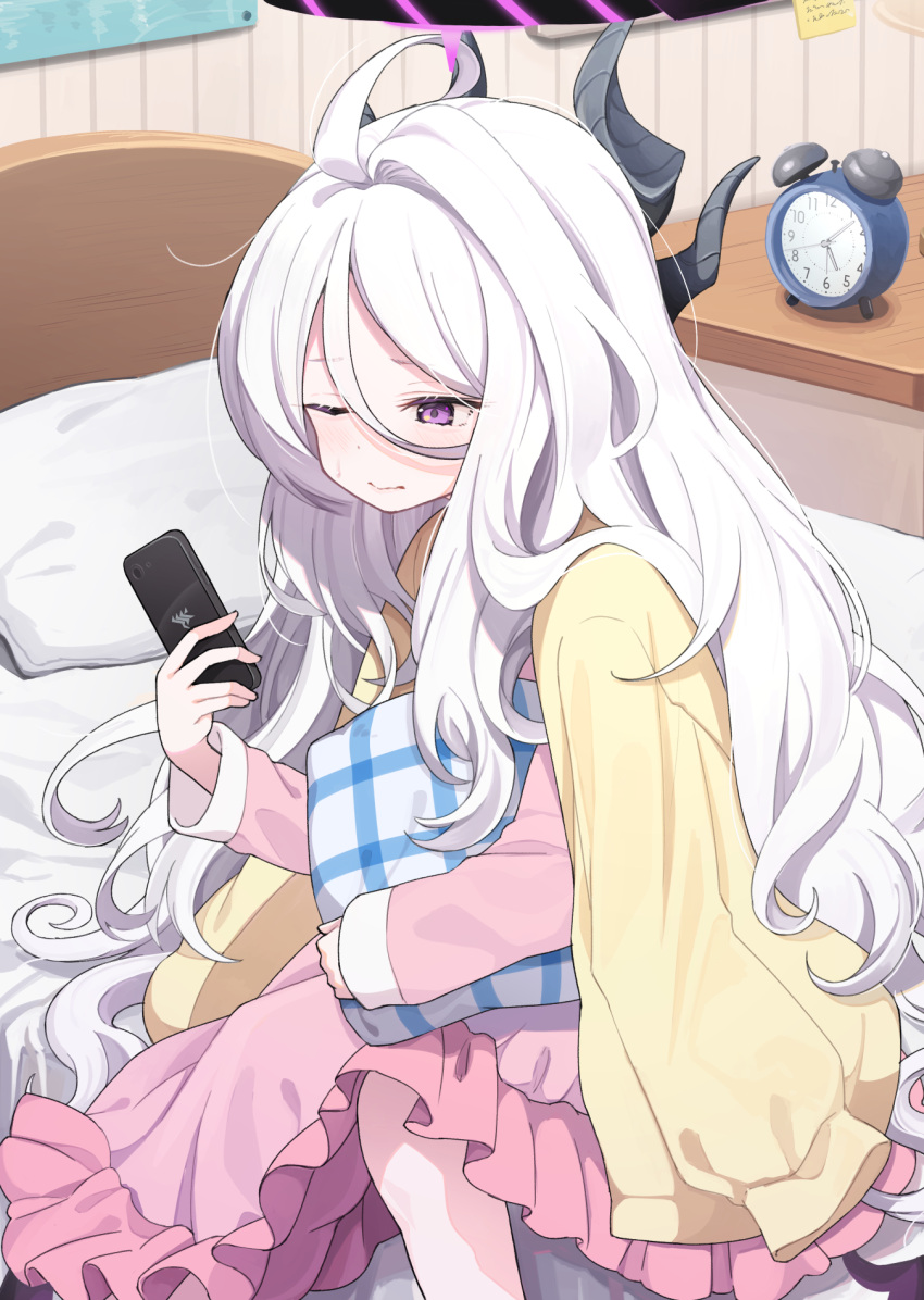 1girl ahoge alarm_clock blue_archive blush cardigan cellphone clock grey_hair hair_between_eyes halo highres hina_(blue_archive) hina_(pajamas)_(blue_archive) holding holding_phone holding_pillow horns indoors long_hair long_sleeves looking_at_phone messy_hair multiple_horns off_shoulder official_alternate_costume on_bed pajamas phone pillow pink_pajamas purple_eyes shirousagi_una sitting smartphone solo sweatdrop very_long_hair wavy_mouth wings yellow_cardigan